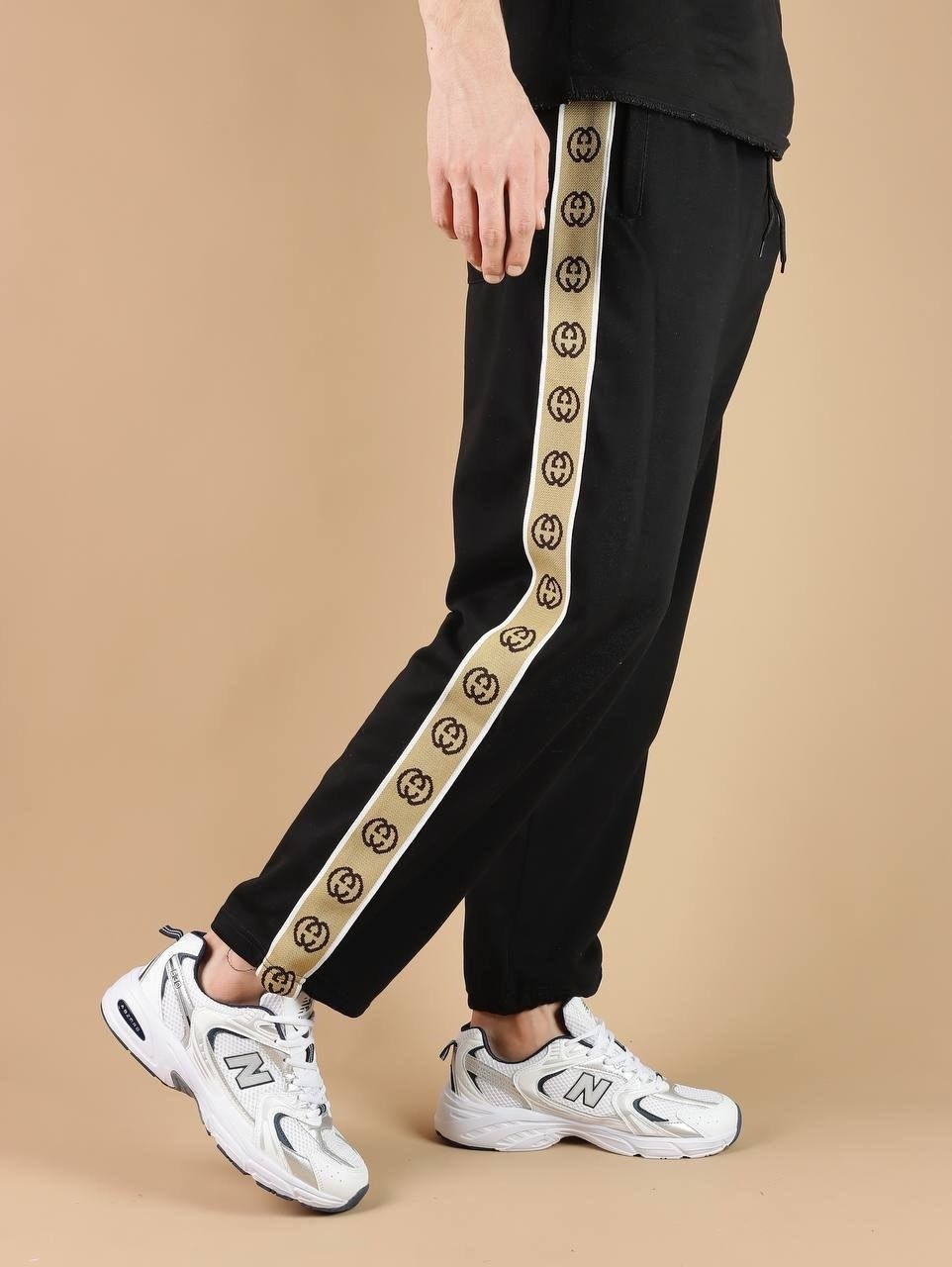 штаны гуччи мужские с полоской,спортивные штаны гуччи,штаны спортивные,спортивные женские штаны гуччи,спортивные штаны гуччи женские черные