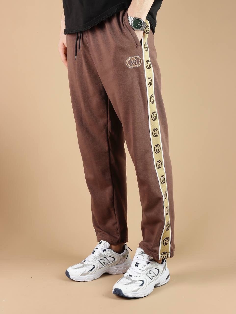 штаны гуччи мужские с полоской,спортивные штаны гуччи,штаны спортивные,спортивные женские штаны гуччи,спортивные штаны гуччи женские черные