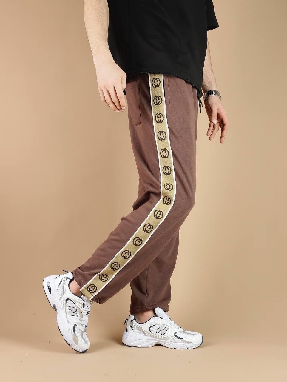 штаны гуччи мужские с полоской,спортивные штаны гуччи,штаны спортивные,спортивные женские штаны гуччи,спортивные штаны гуччи женские черные